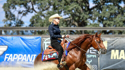 Mitch and I sliding at Reining By the Bay competition. Woodside, CA